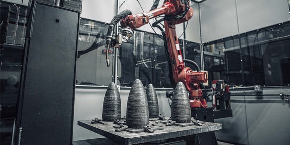 Robotic weld cell for large-scale metal additive manufacturing with 3D-printed steel aerospace mandrels