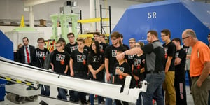 Students examining aerospace tooling while on a tour of Baker Industries for Manufacturing Day 2016