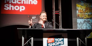 Jerry Kablak, Program Engineer at Baker Industries, a Lincoln Electric Company, accepting Baker's 2018 Top Shop award from Modern Machine Shop